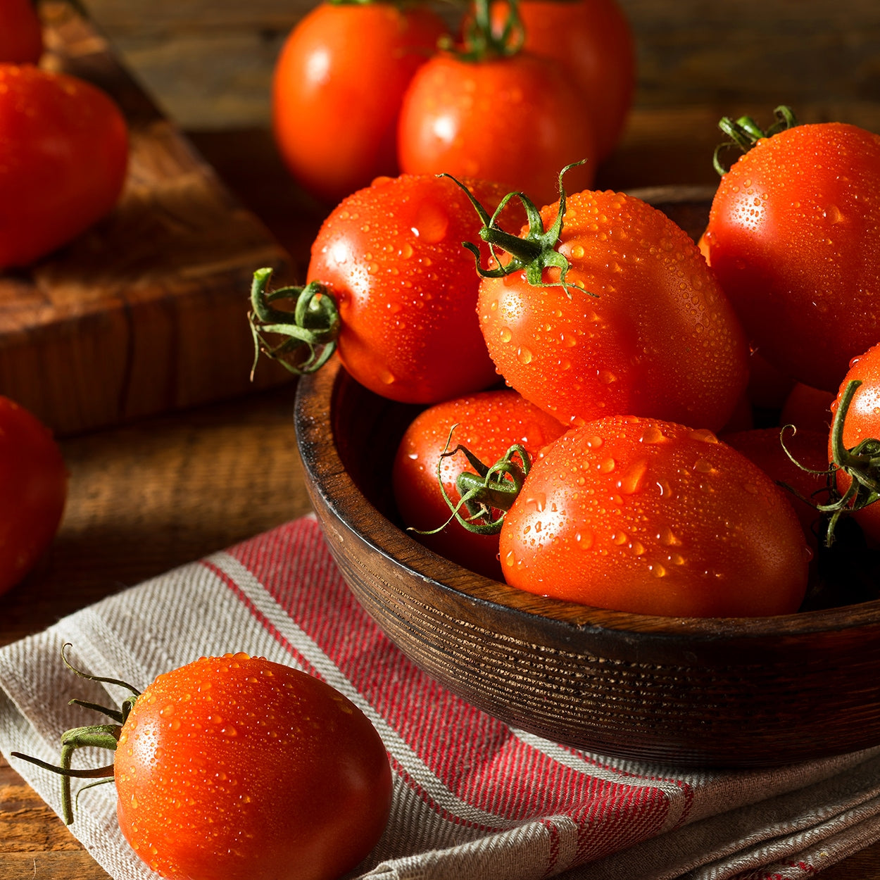 Tomatoes in a basket on a counter 